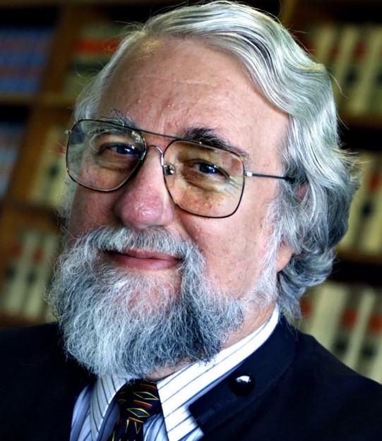 The Hon Michael F Adams QC